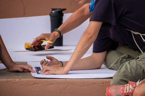 Checking the building plan for a washroom to be constructed 