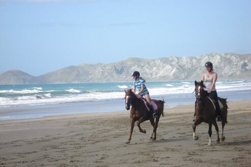 Farmstay girl taking the families daughter for a beach ride