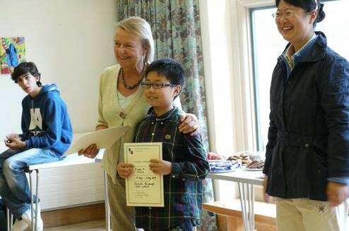a junior student receives his Oxford International Study Centre certificate . 