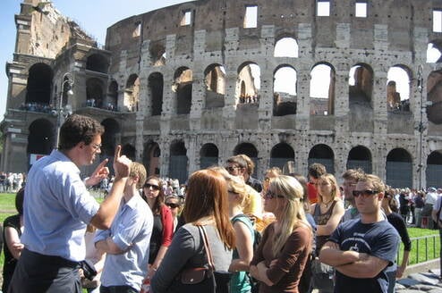 Students in front of Roman Coliseum in Rome