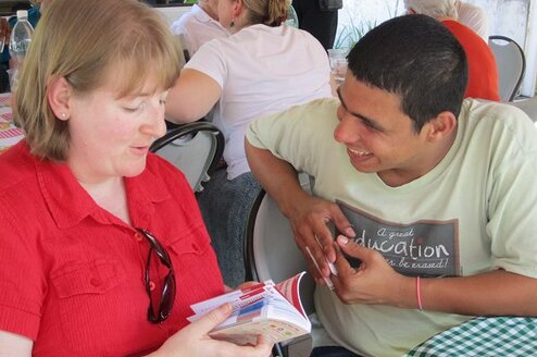 Teach English to youth and adult students.