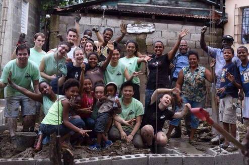 group of volunteers in front of building