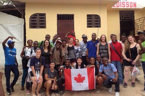 Group of volunteers in front of building