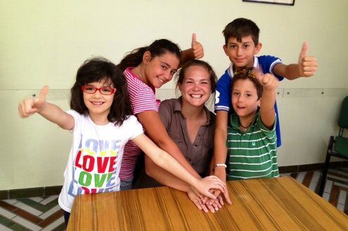 Volunteer playing with the children in Italy