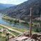 photo of river with a cross in the foreground