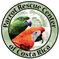 Round green logo with black text reading Parrot Rescue Center of Costa Rica along border. In the center are the heads of a Scarlet Macaw and a Yellow Naped Amazon