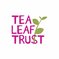 Tea Leaf Trust logo words with green tea leaf growing out of them