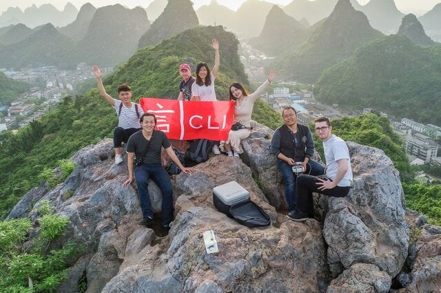 young people after a hike on top of a mountain in guilin