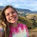 headshot of girl in mountains