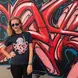 woman standing by mural