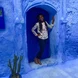 girl in blue doorway