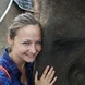 headshot of woman and elephant