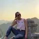 Kelly posing at an overlook of a valley