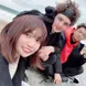Nanami poses with interns on a beach