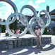 Jonas Hudnall standing in front of the Olympics sign 