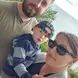 Jacob Thamas with his wife and son with the ocean in the background