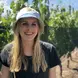 Madison Purnell outside wearing a bucket hat smiling with long blonde hair