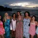 Katie poses with friends in front of ocean
