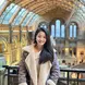 Kitty poses for a photo in a train station