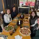 Carolina and friends enjoy a meal together