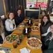 Carolina and friends enjoy a meal together