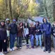 Eugene and fellow students pose for a photo in the forest