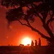 maasai warriors at sunset in maasai mara