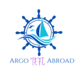 A dark blue ship wheel with a light blue ship in the middle with small blue birds floating above the mast. The brand name is Argo TEFL Abroad.