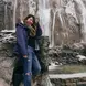 jane balancing herself in front of a waterfall in plitvice lakes, croatia