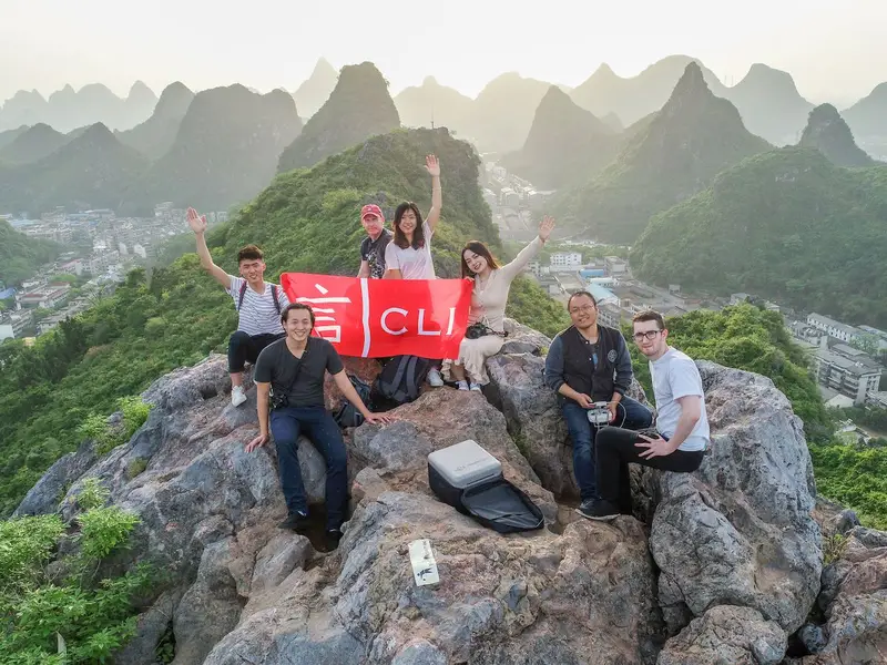 young people after a hike on top of a mountain in guilin