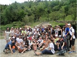 Student backpacker overlooking a misty Chinese landscape
