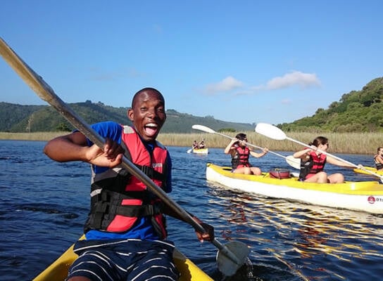 Male student on a kayak living his best life in Cape Town 