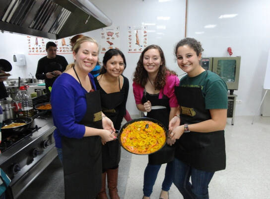 IES Abroad Salamanca students cooking a traditional Spanish dish 