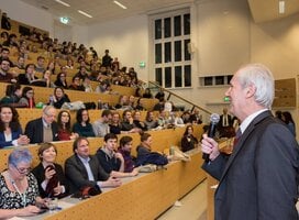 Old man telling something in the stage