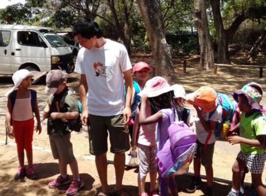 intern with school children