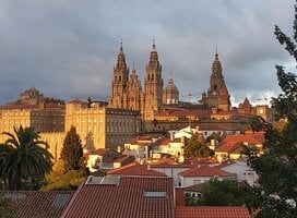 Santiago de Compostela cityscape with dark clouds