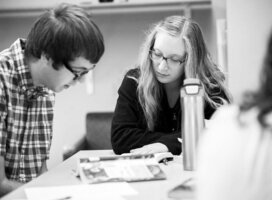 Girl is teaching the guy