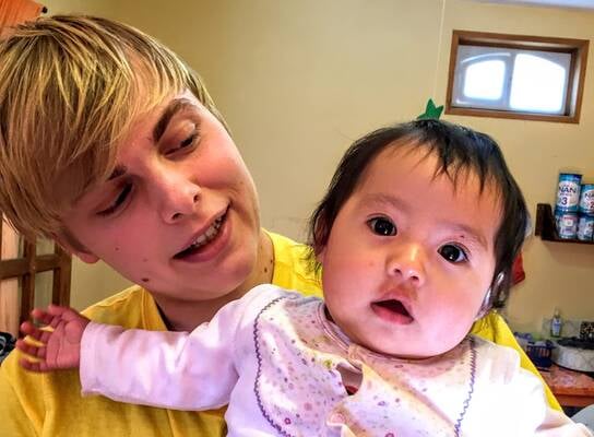 Volunteer Christian with Child