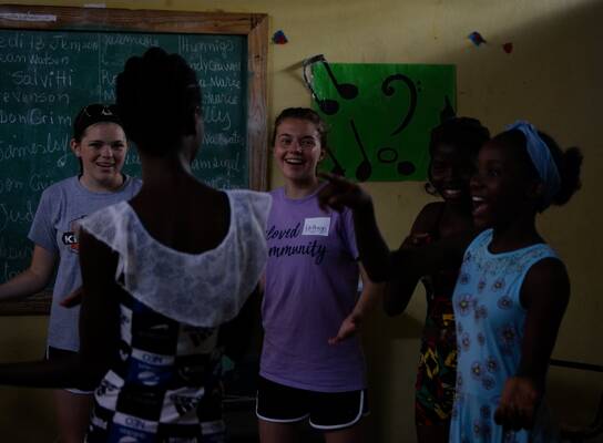 Summer Camp Volunteers teaching our students songs in English!