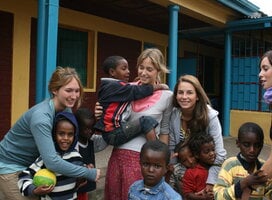 A team of volunteers working with children