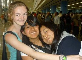 American intern hugging Mexican friends