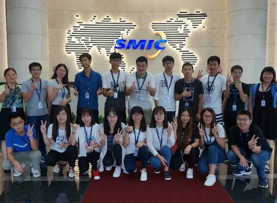 interns from internship in china program happily taking photos with co-workers in SMIC