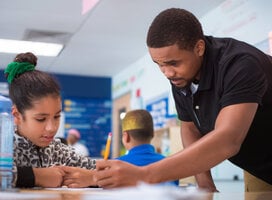 Staff interacting and mentor students