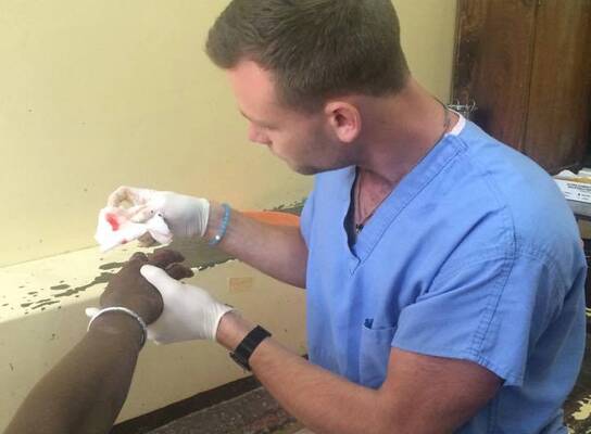 A PA attending to a patient at our placement in Mombasa, Kenya