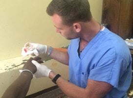 A PA attending to a patient at our placement in Mombasa, Kenya
