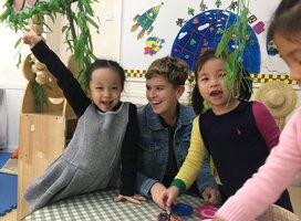 Kindergarten Chinese students with a female American teacher