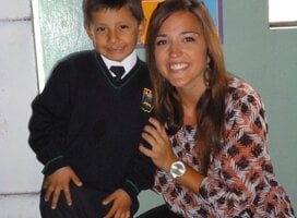 Volunteer with her student after culminating a teaching English program.