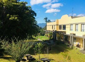 blue skies over a yellow Costa Rican building