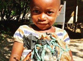This young soccer player proudly shows us his ball 