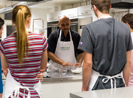 Teenagers listening to chef